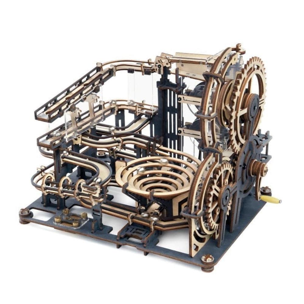 Wooden mechanical model with gears and tracks on a white background