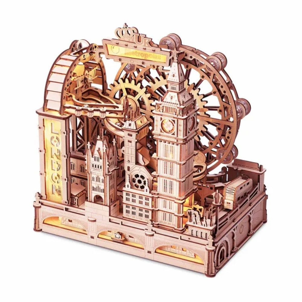 Wooden mechanical model of a clock tower with gears on a white background