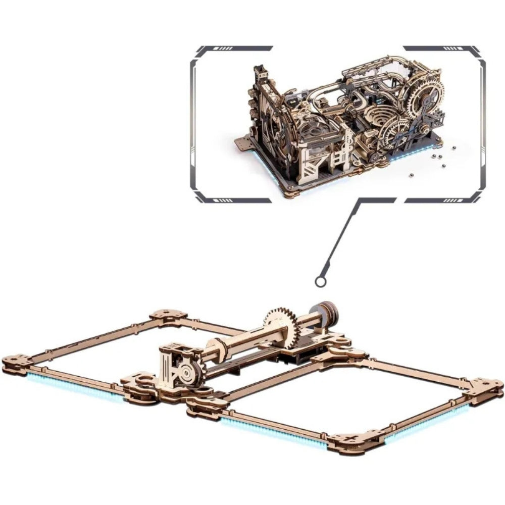 Wooden mechanical model kit with detailed gears on a white background
