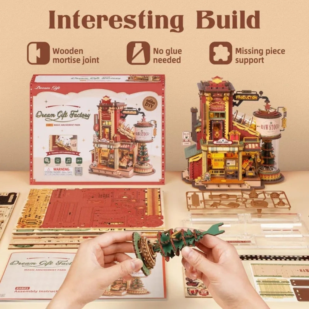 Wooden model building set with packaging and components on a beige background